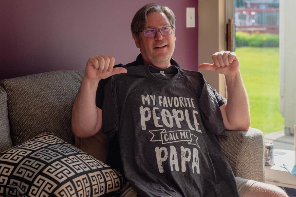 Custom printed family shirts with team roles labeled for a reunion game