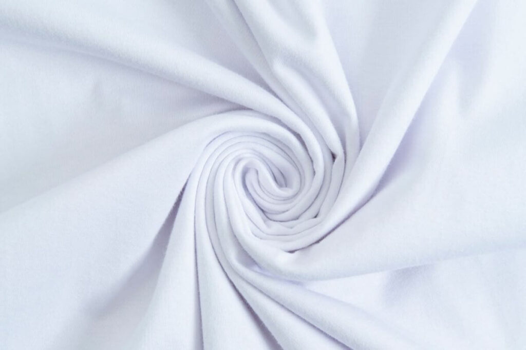 Close-up of soft white shirt fabric showing smooth texture