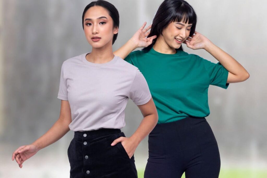 Two female models wearing plain shirts for corporate branding and uniforms