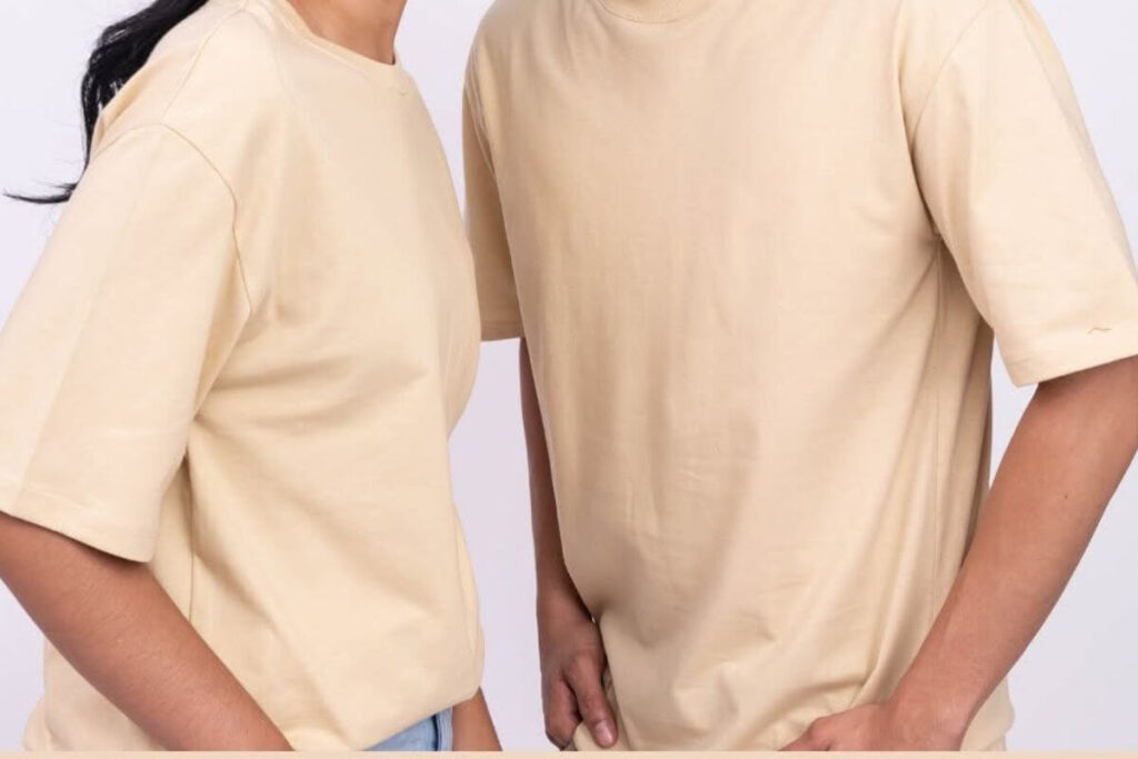 Male and female models wearing cream plain shirts for bulk apparel planning