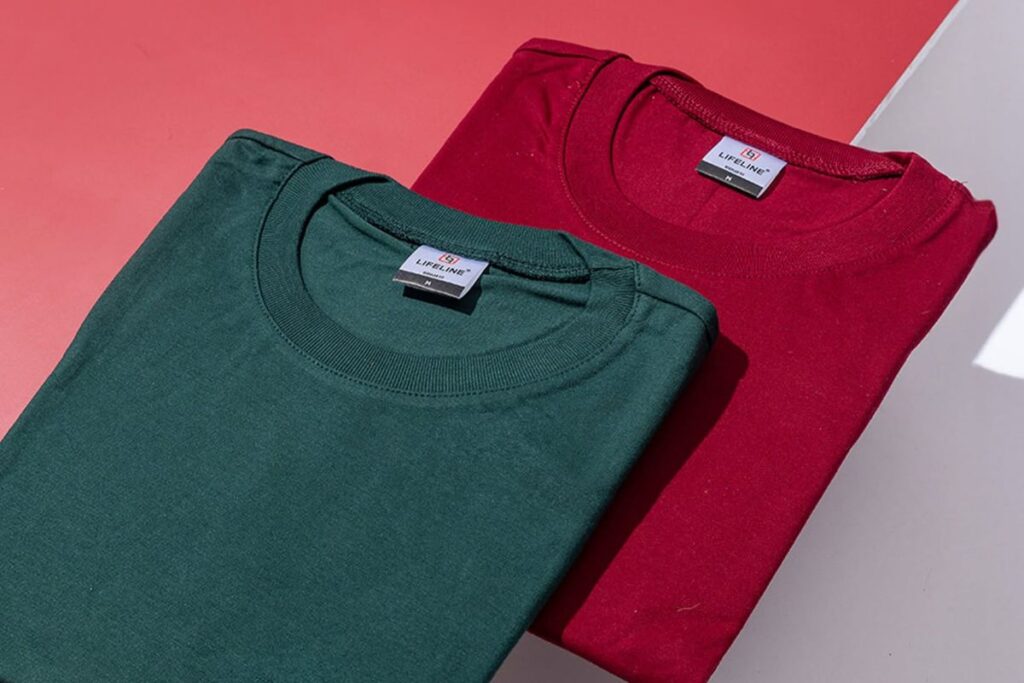 Folded green and red Lifeline plain shirts for wholesale T-shirt comparison
